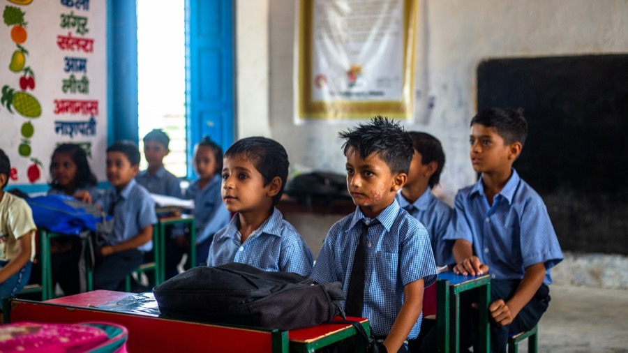 Children sitting at desks in a classroom