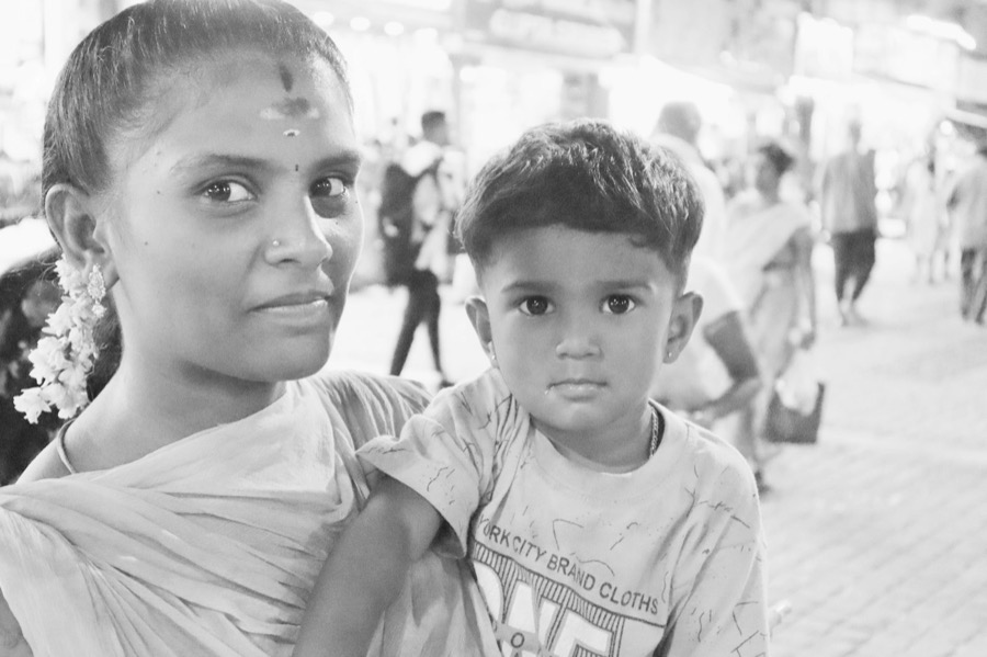 A mother and her young son on a street in Madurai